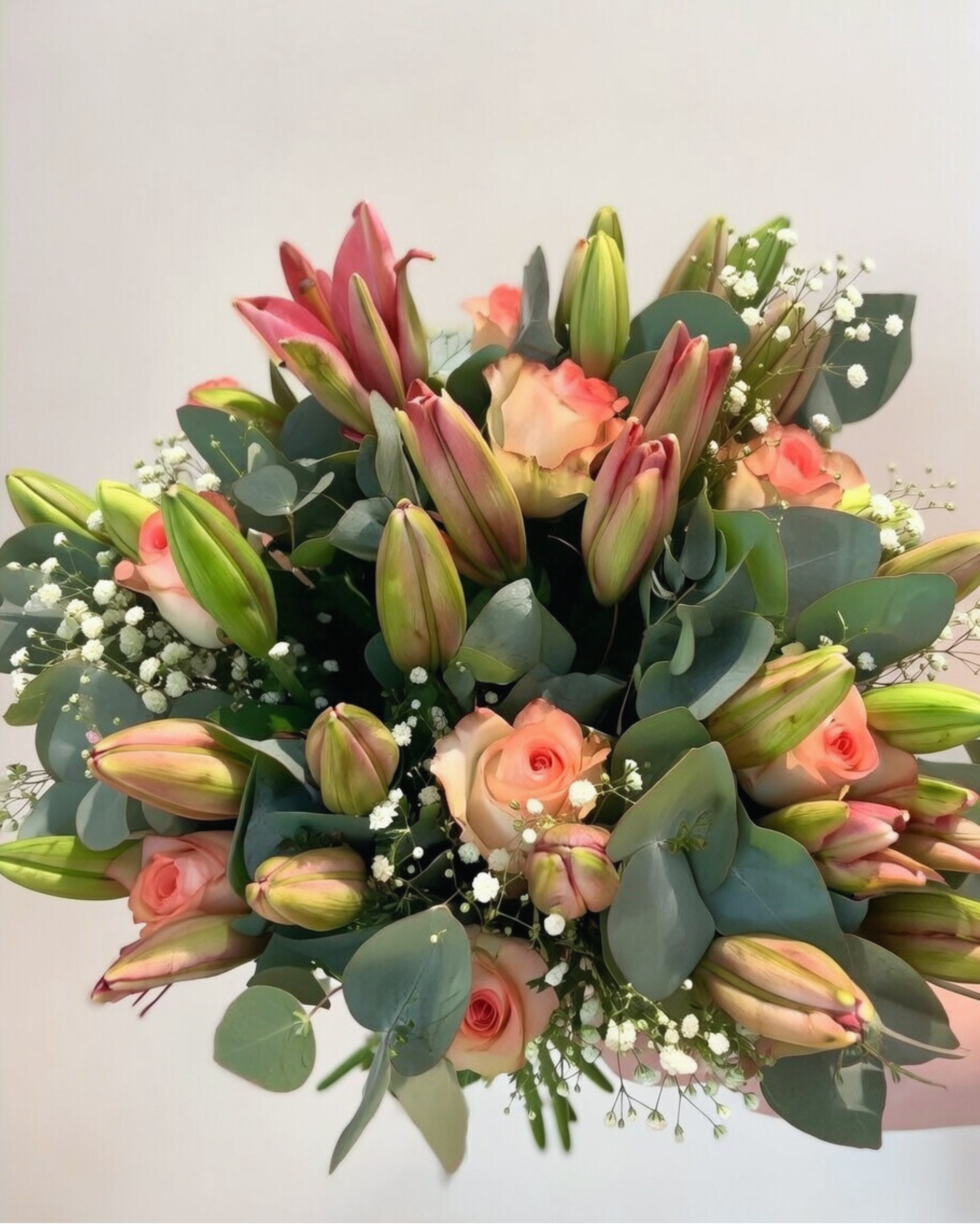 Elegant white roses and eucalyptus arrangement