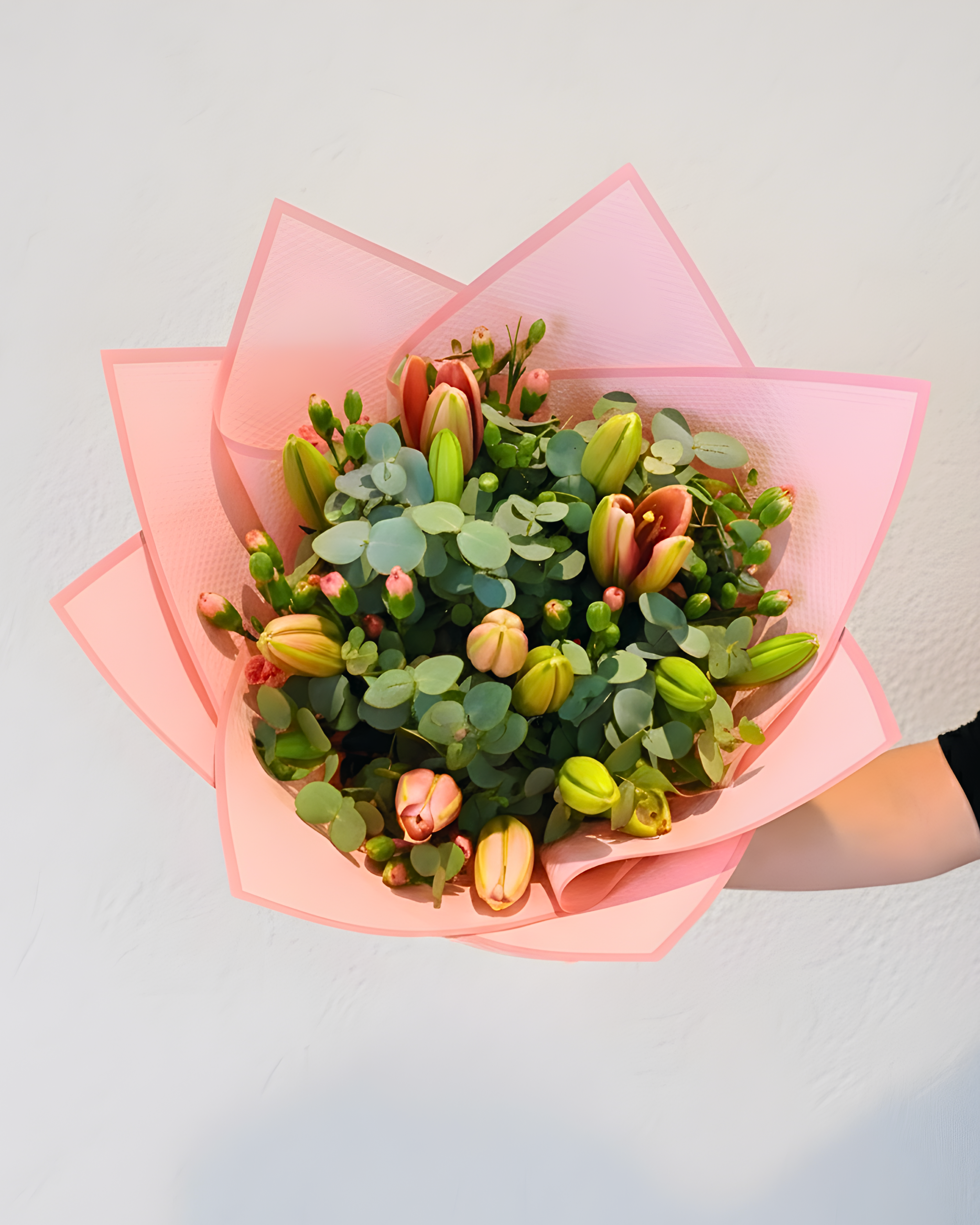 Tropical arrangement with proteas and greenery